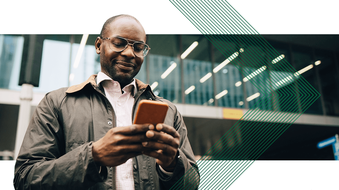 diverse man uses mobile compliance technology near office building